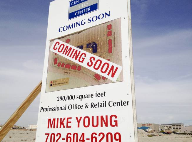 A peeling and apparently sunburned sign at the project site of the Medical-office project Centennial Hills Center, which was mothballed and vandalized after lender Lehman Brothers collapsed March 20, 2014.  The center has new ownership and is slated for completion.